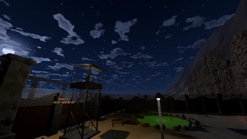 A watchtower and fenced compound at night under a starry sky with drifting clouds